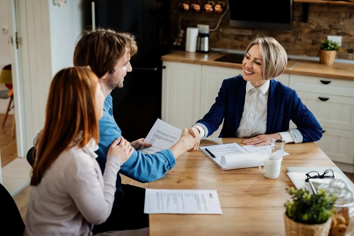 People reviewing insurance documents together